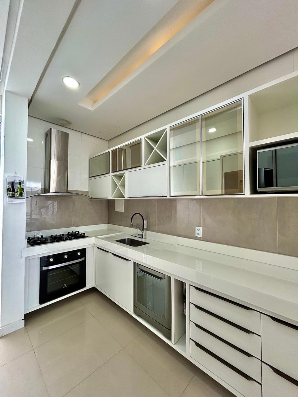 Kitchen or kitchenette, dishwasher, oven, stove