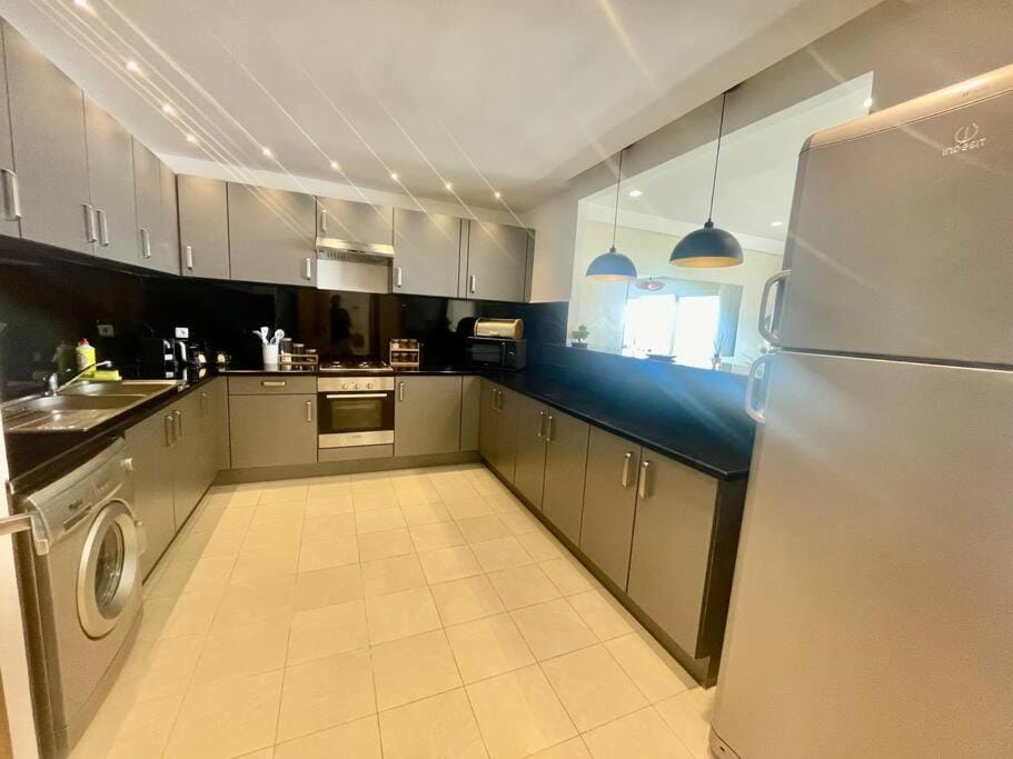Kitchen or kitchenette, oven, stove, washing machine