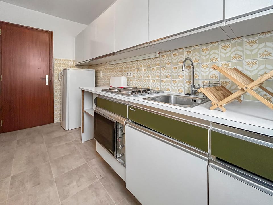 Kitchen or kitchenette, oven, stove, toaster