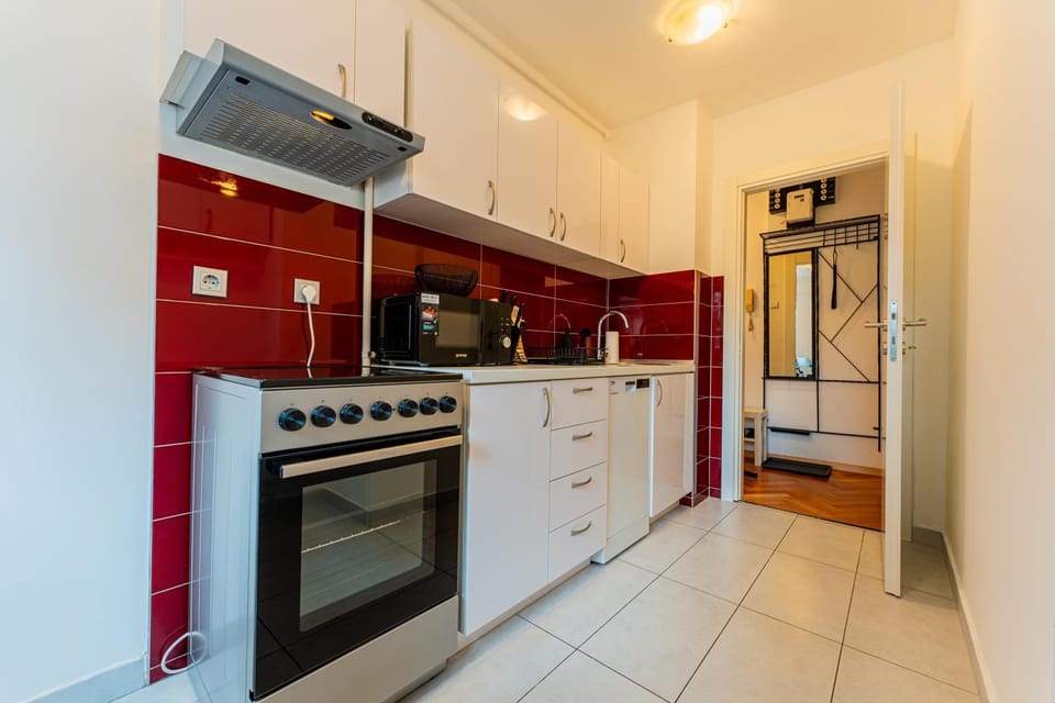 Kitchen or kitchenette, dishwasher, microwave, oven, stove
