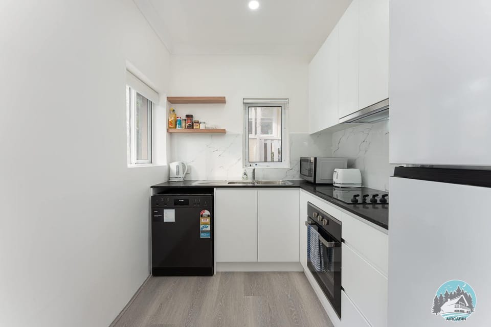 Kitchen or kitchenette, dishwasher, oven, stove