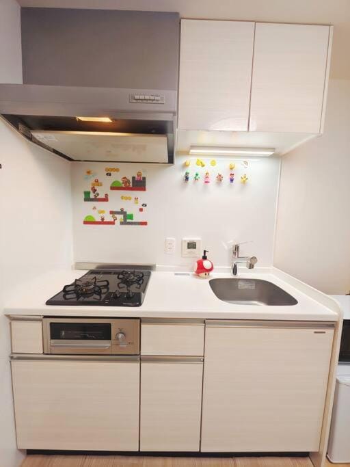 Kitchen or kitchenette, stove