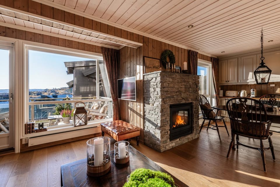 View (from property/room), Balcony/Terrace, Kitchen or kitchenette, Living room, Seating area, Dining area, fireplace