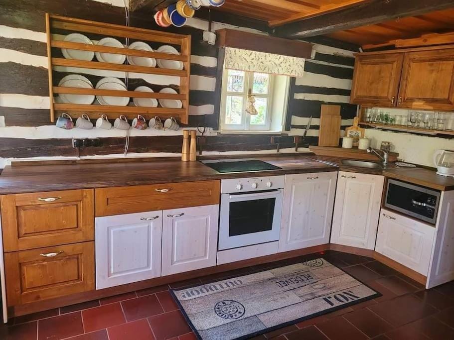 Kitchen or kitchenette, dishwasher, oven, stove