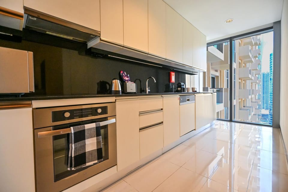 Kitchen or kitchenette, dishwasher, oven, stove