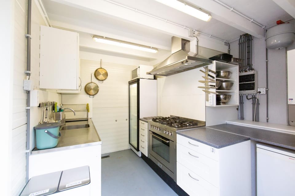 Kitchen or kitchenette, dishwasher, oven, stove