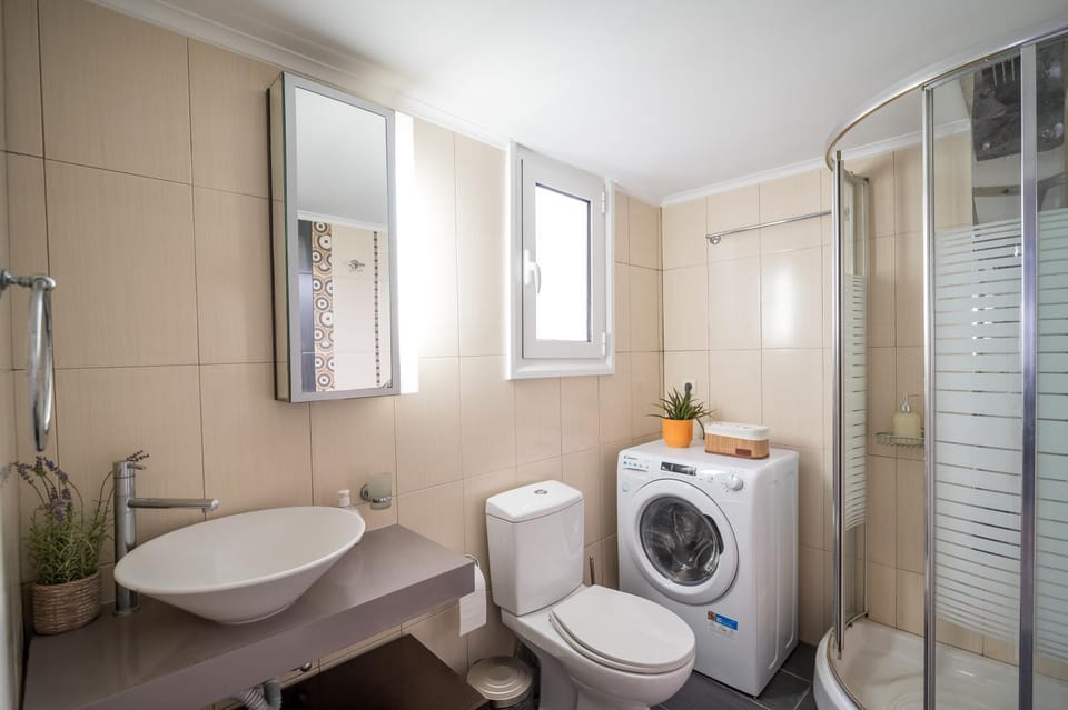 Shower, Toilet, Bathroom, towels, washing machine, dryer