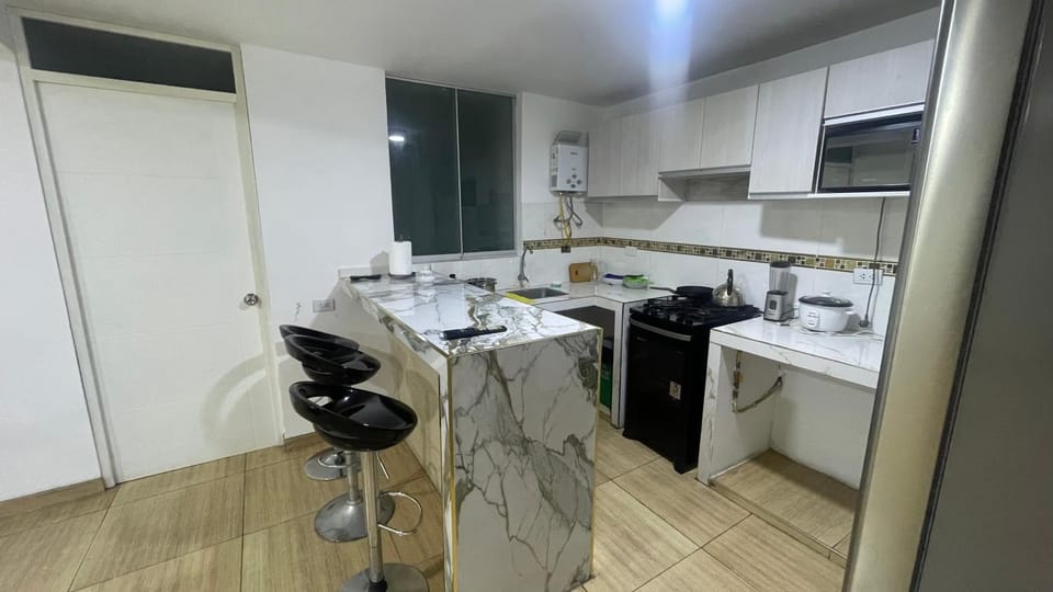 Kitchen or kitchenette, dishwasher, oven