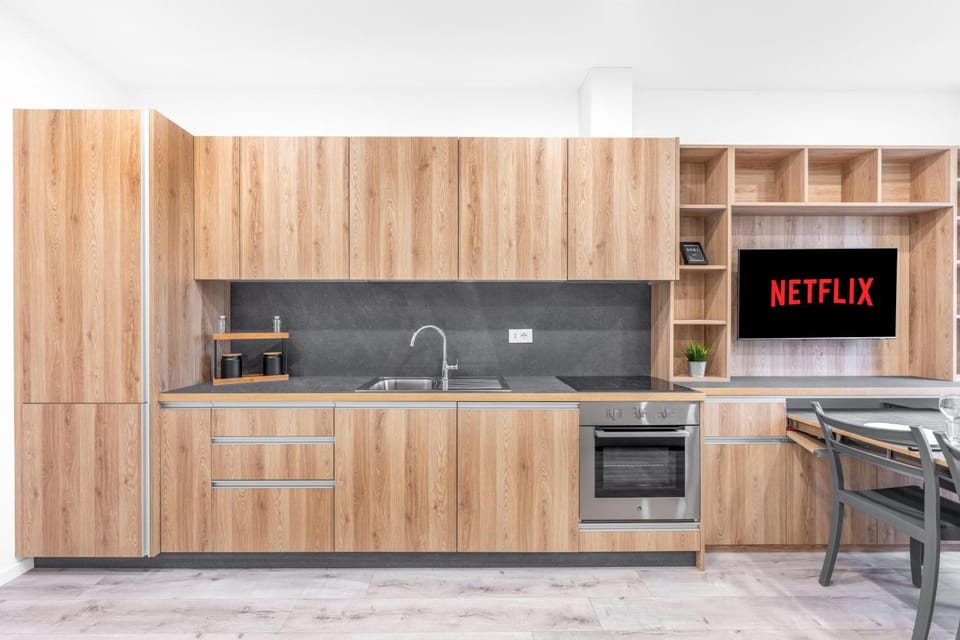 Kitchen or kitchenette, dishwasher, oven, stove