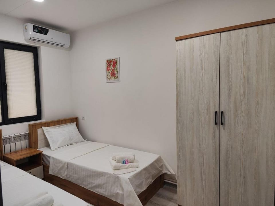 Bed, towels, wardrobe, air conditioner