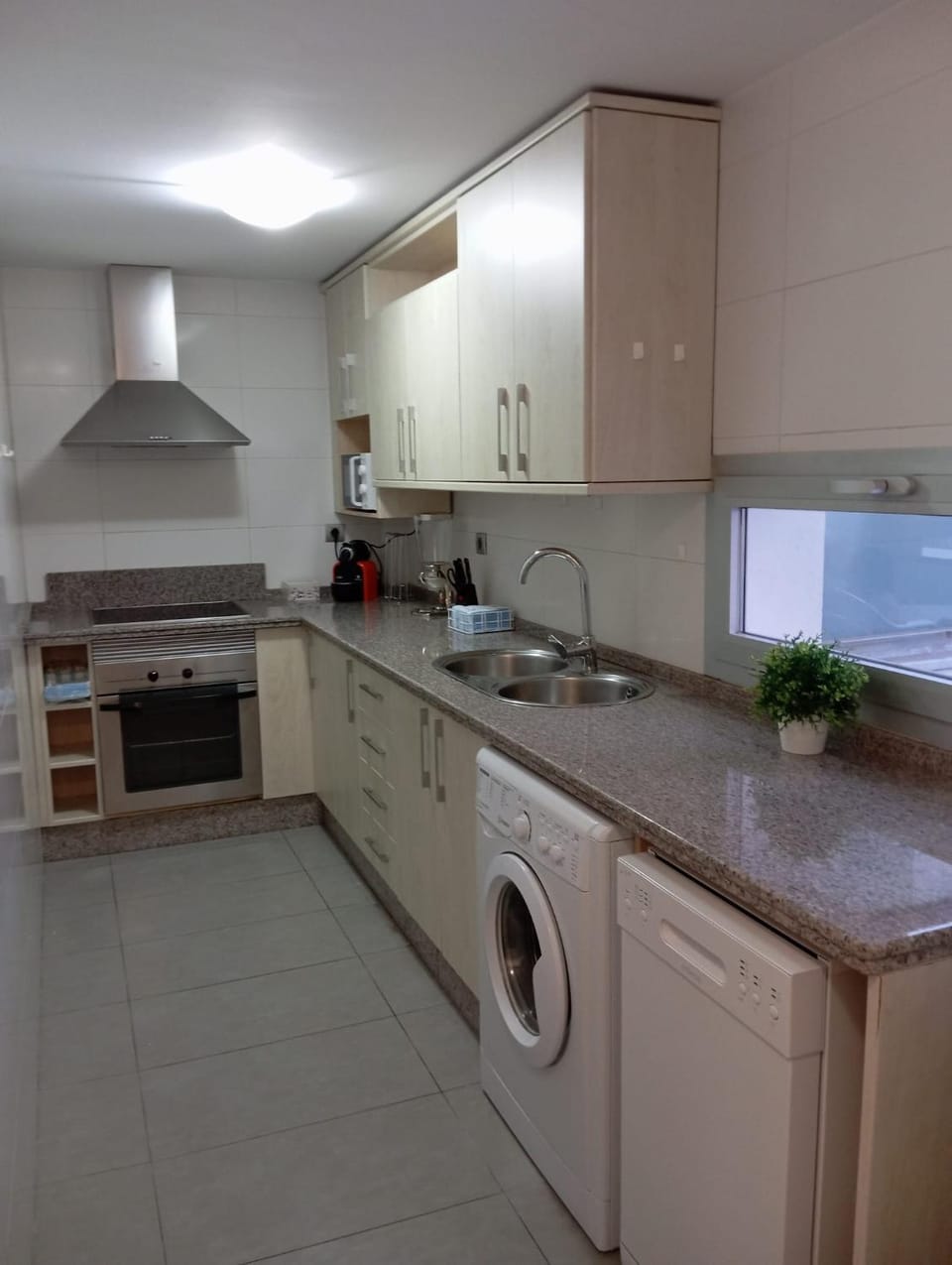Kitchen or kitchenette, dishwasher, stove, washing machine