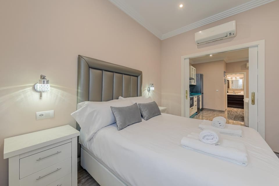 Bed, Photo of the whole room, Bedroom, towels, air conditioner