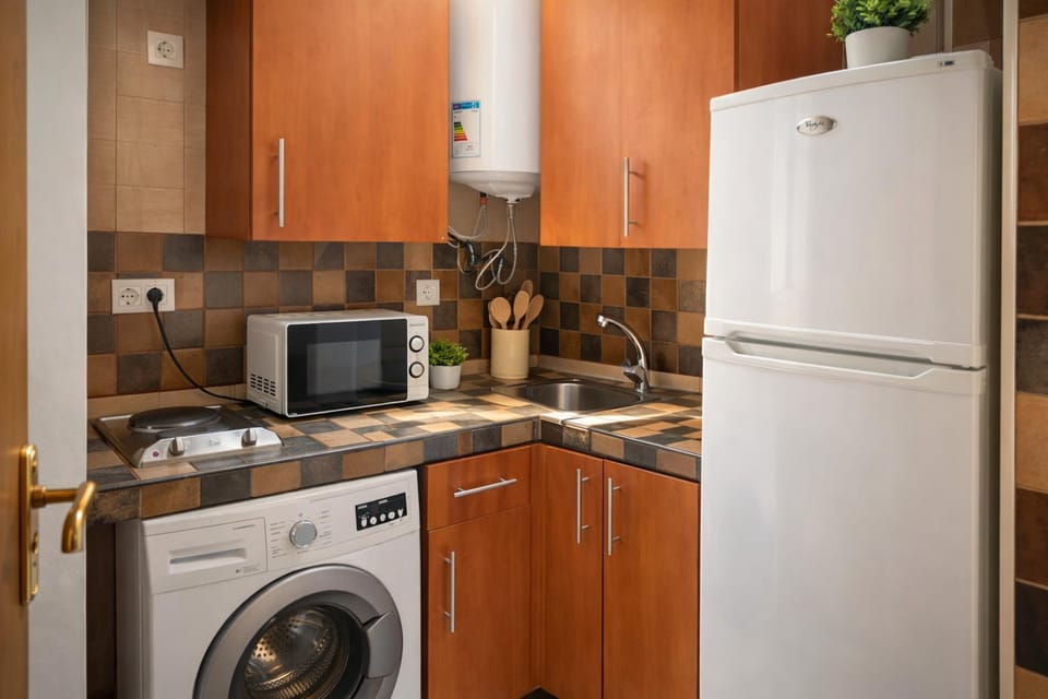 Kitchen or kitchenette, stove, washing machine