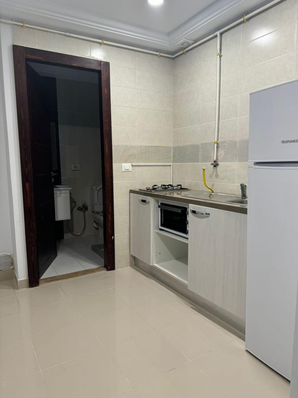 Kitchen or kitchenette, oven, stove