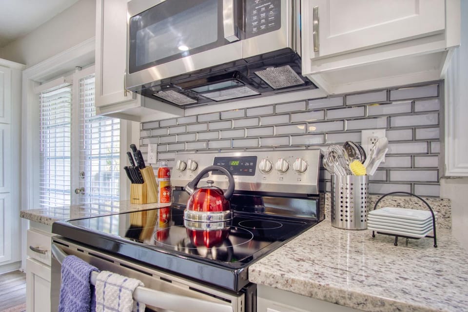 Kitchen or kitchenette, dishwasher, oven, stove