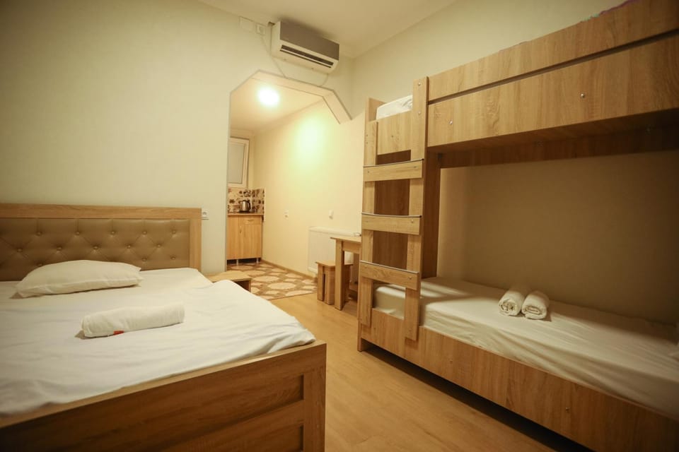 Bed, Photo of the whole room, Bedroom, bunk bed, towels, air conditioner