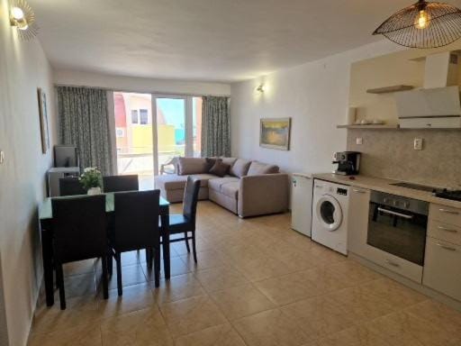 Kitchen or kitchenette, Living room, Dining area, oven, stove, washing machine