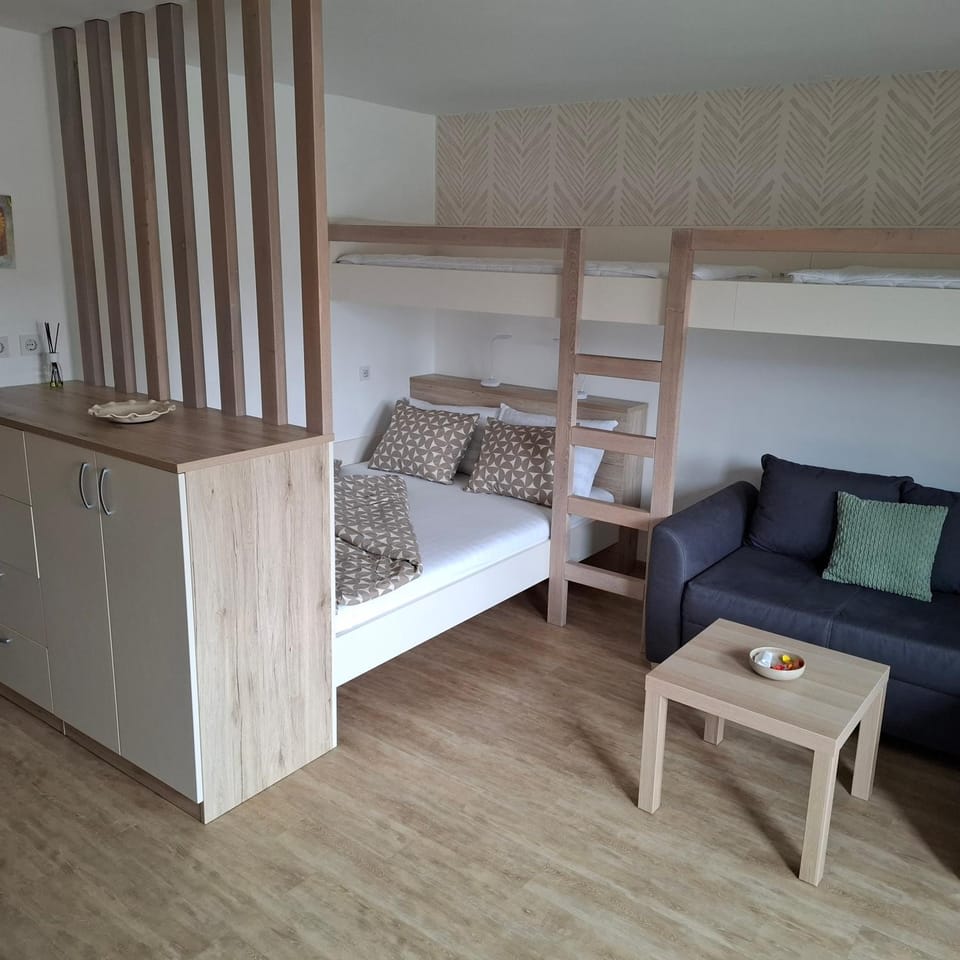 Bed, Living room, Seating area, Bedroom