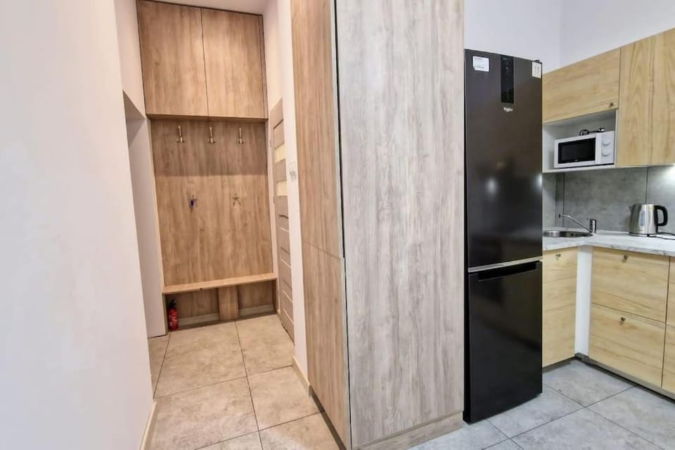 Kitchen or kitchenette, stove, wardrobe, washing machine