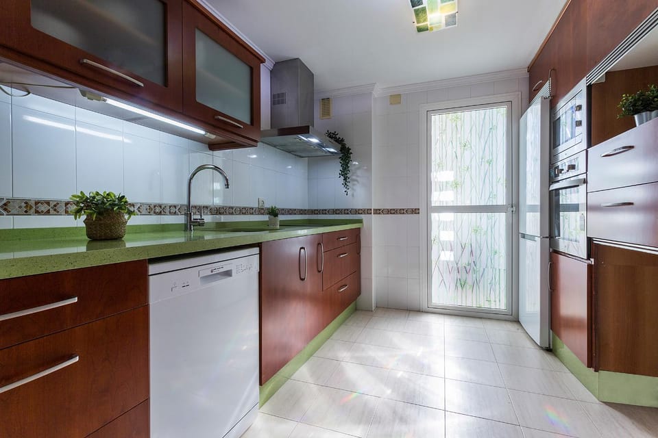 Kitchen or kitchenette, dishwasher, oven, stove