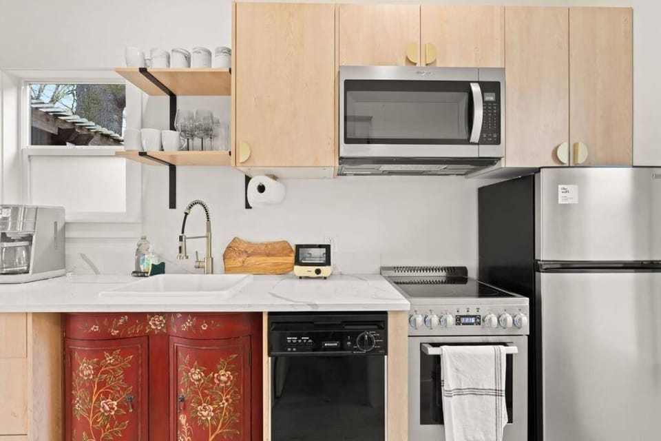 Kitchen or kitchenette, dishwasher, microwave, oven, stove, toaster