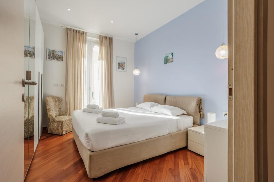 Bedroom, City view, furniture, towels, wardrobe