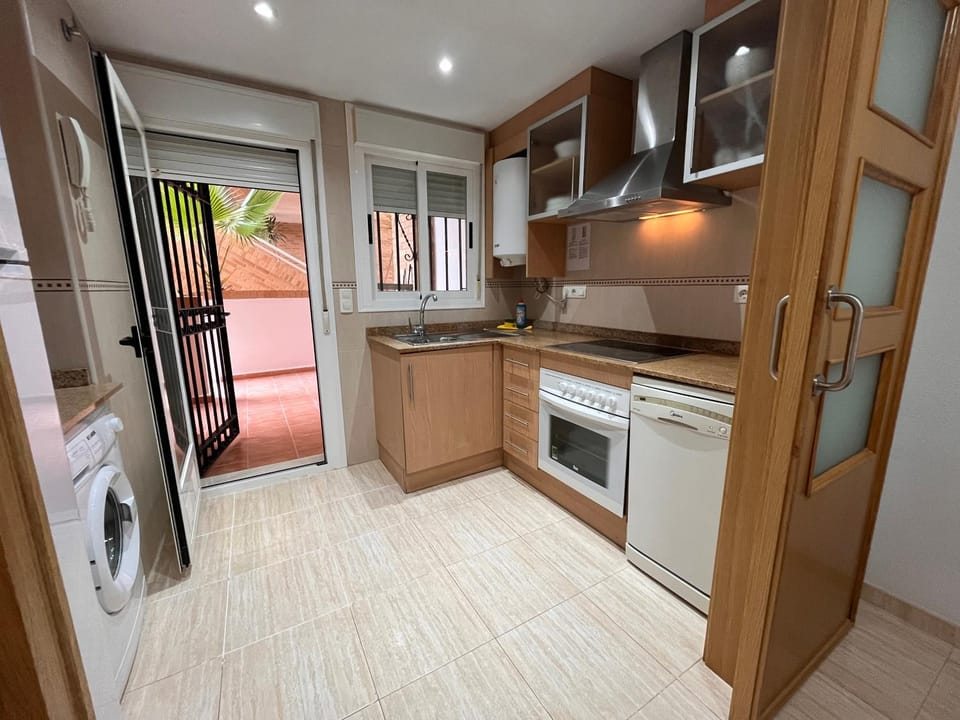 Kitchen or kitchenette, dishwasher, oven, stove