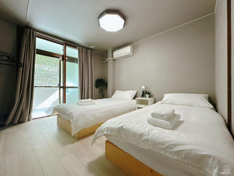 Bed, Photo of the whole room, Bedroom, towels, air conditioner