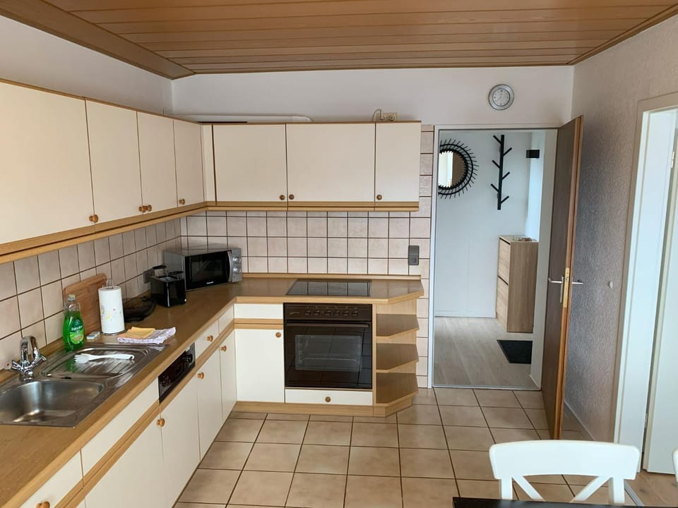 Kitchen or kitchenette, dishwasher, oven, stove, toaster