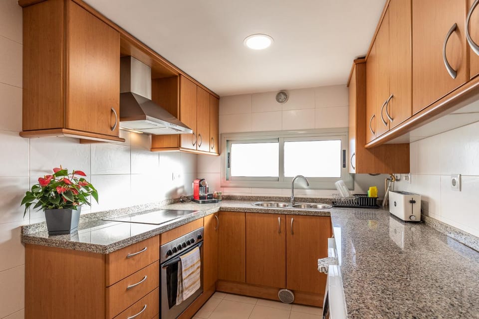 Kitchen or kitchenette, dishwasher, oven, stove