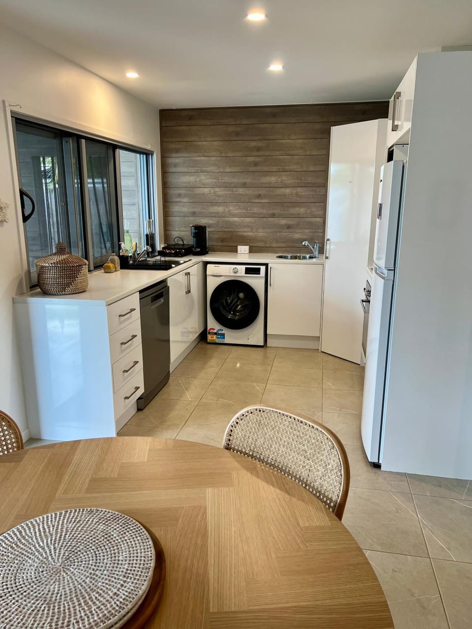 Kitchen or kitchenette, dishwasher, oven, stove, toaster, washing machine