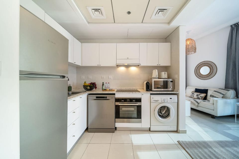 Kitchen or kitchenette, dishwasher, oven, stove, toaster, washing machine