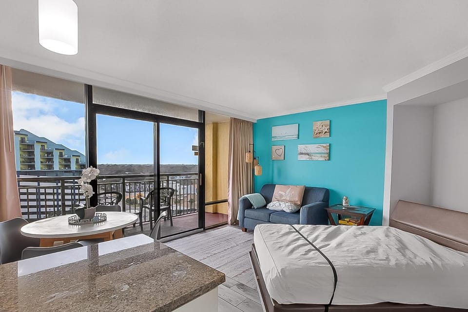 Bed, View (from property/room), Balcony/Terrace, Living room, Seating area, Dining area, Beach