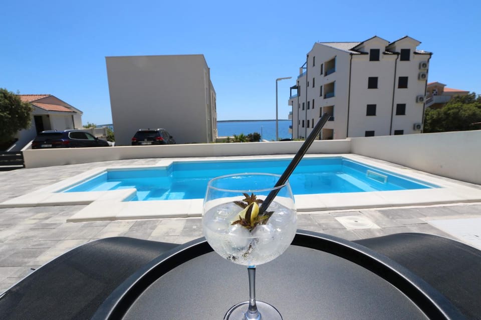 Dolphin view II with a pool by the beach Apartment in Novalja