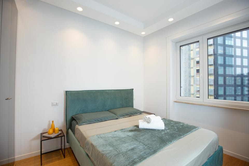 Bed, Decorative detail, Bedroom, City view, City view, towels, wardrobe