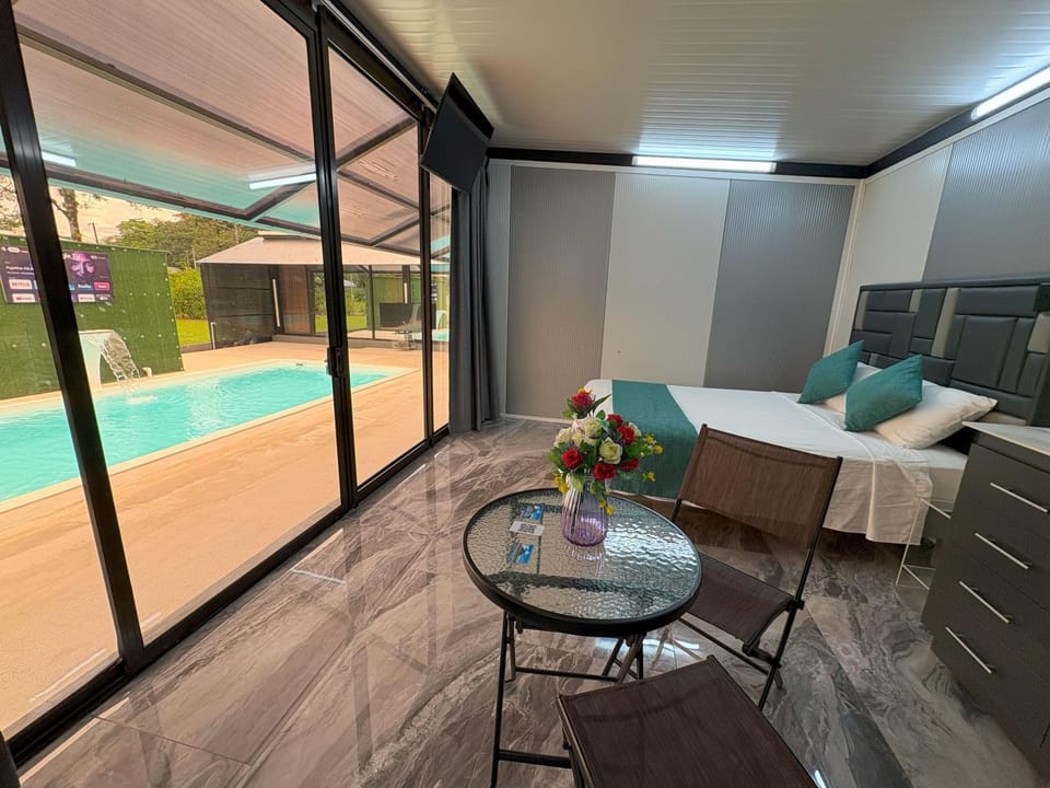 Living room, Seating area, Pool view, Swimming pool, sunbed