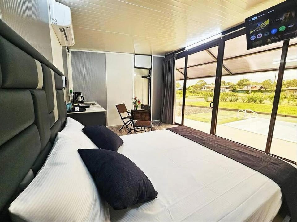 Communal lounge/ TV room, Bed, TV and multimedia, View (from property/room), Bedroom, air conditioner