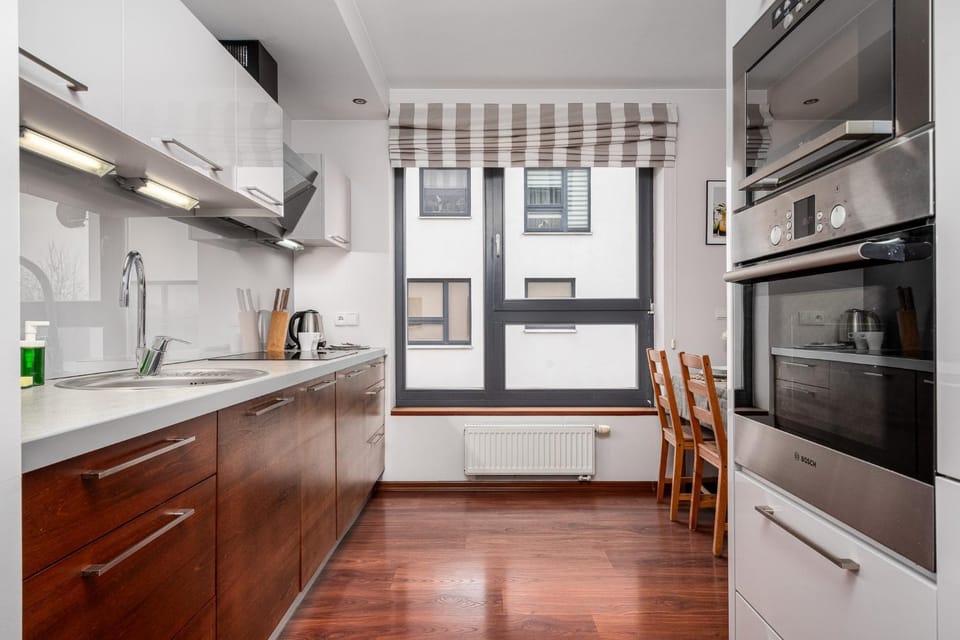 Kitchen or kitchenette, dishwasher, oven, stove