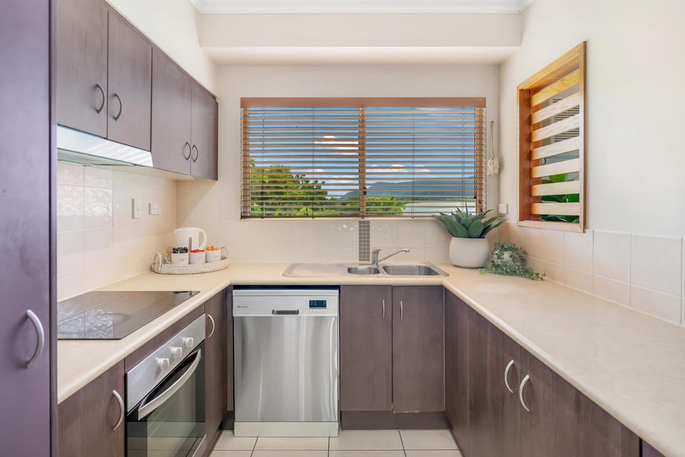 Kitchen or kitchenette, dishwasher, oven, stove