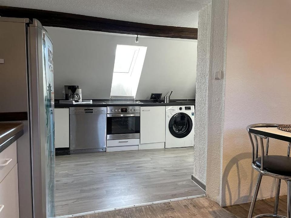 Kitchen or kitchenette, dishwasher, stove, washing machine
