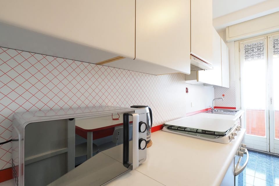 Kitchen or kitchenette, dishwasher, oven, stove