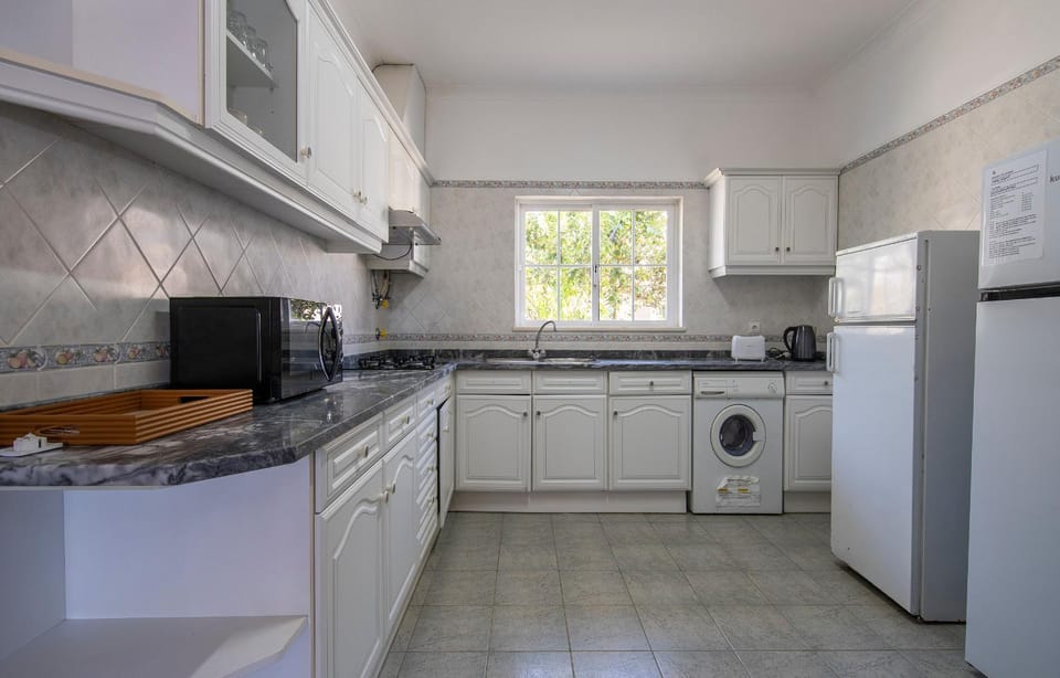 Kitchen or kitchenette, stove, toaster