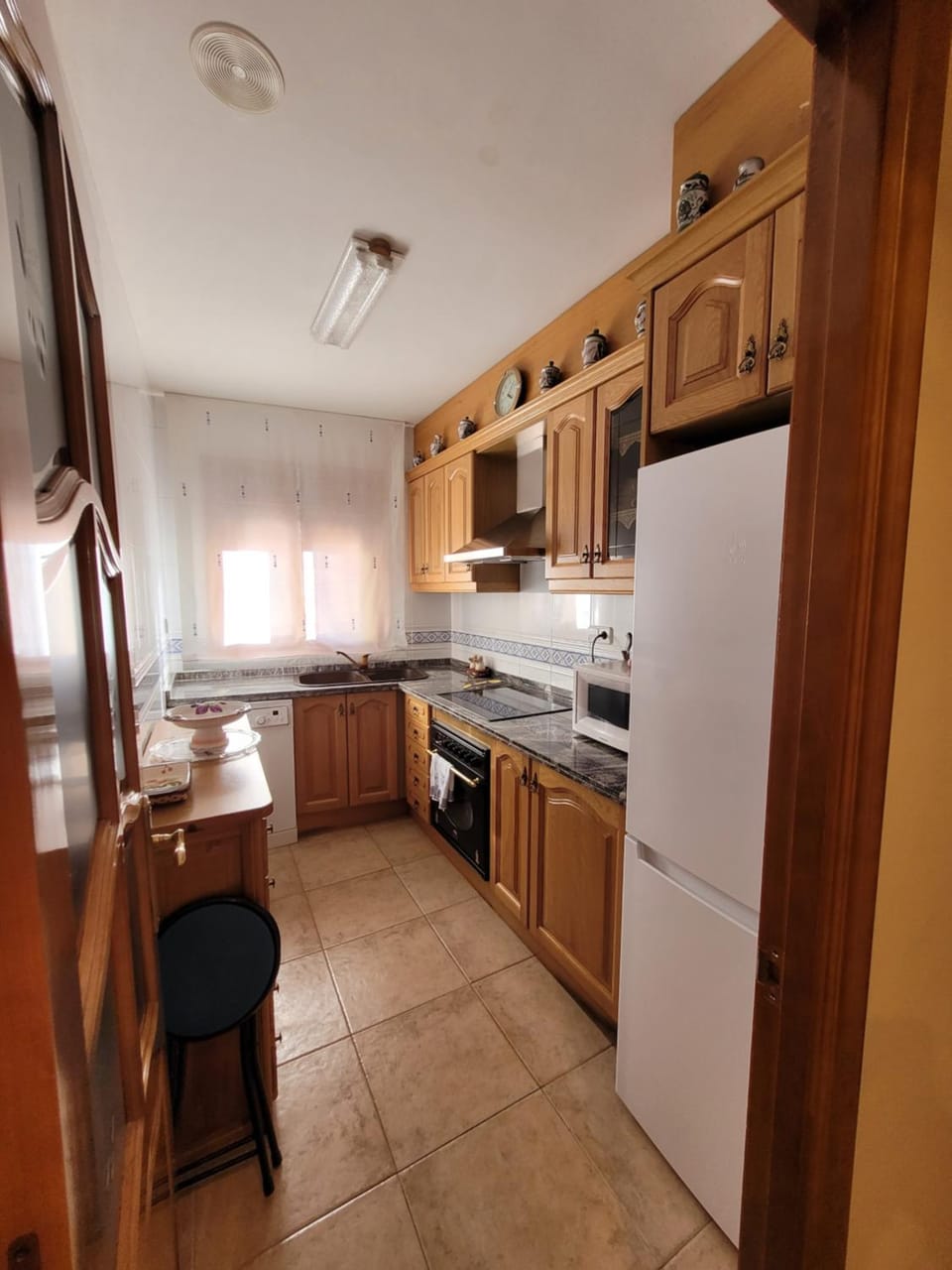 Kitchen or kitchenette, dishwasher, oven, stove