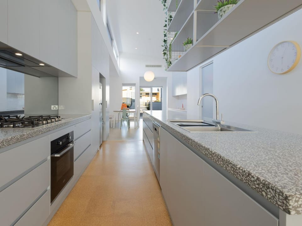 Kitchen or kitchenette, dishwasher, oven, stove
