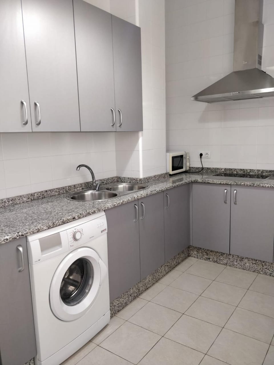 Kitchen or kitchenette, stove, washing machine