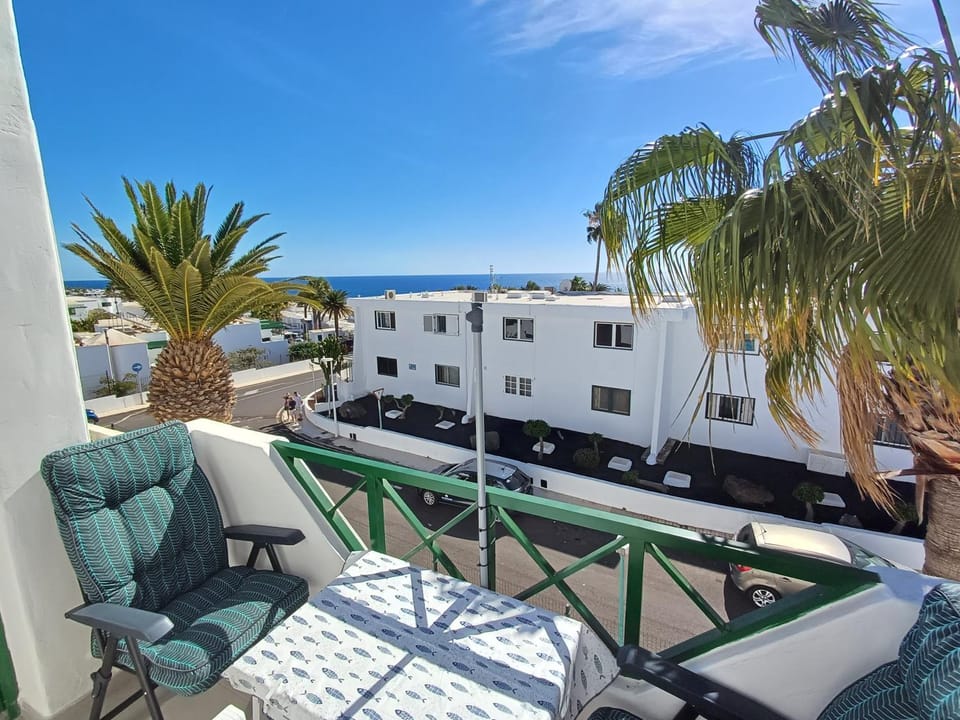 TOP FLOOR OCEAN VIEWS Lanzamar - Renovated Gem with a Sunny, Private Terrace & Elevator & Pool - Puerto del Carmen Apartment in Puerto del Carmen