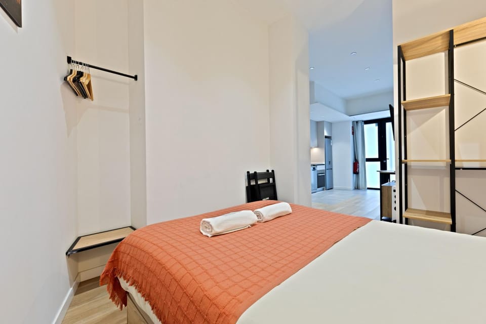 Bed, towels, wardrobe