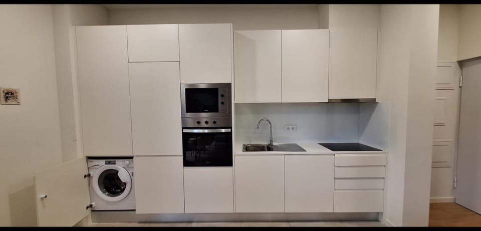 Kitchen or kitchenette, oven, stove, washing machine, dryer