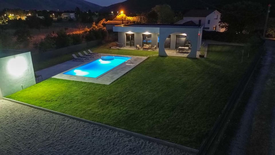 Property building, Night, Pool view, Swimming pool, sunbed