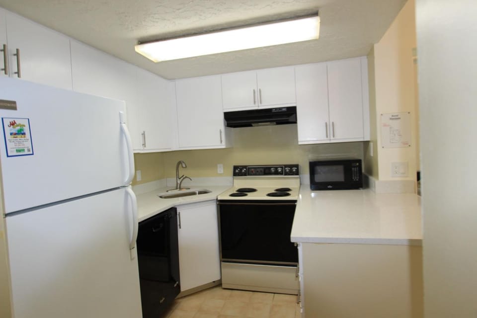 Kitchen or kitchenette, dishwasher, oven, stove, toaster
